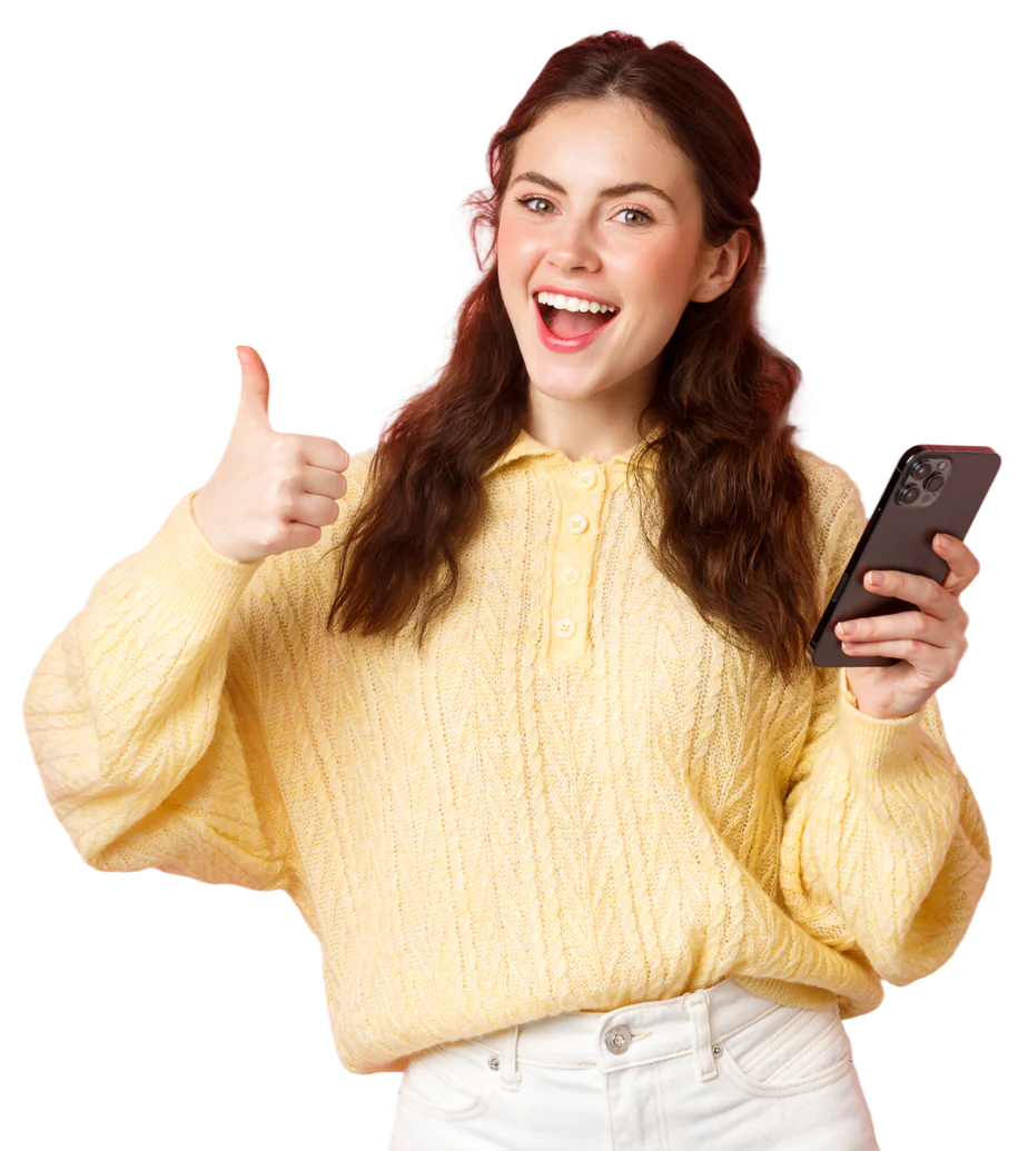 Smiling woman in a yellow sweater giving a thumbs up with a phone